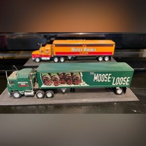 The Moose Loose and honey brown match box truck with trailer
